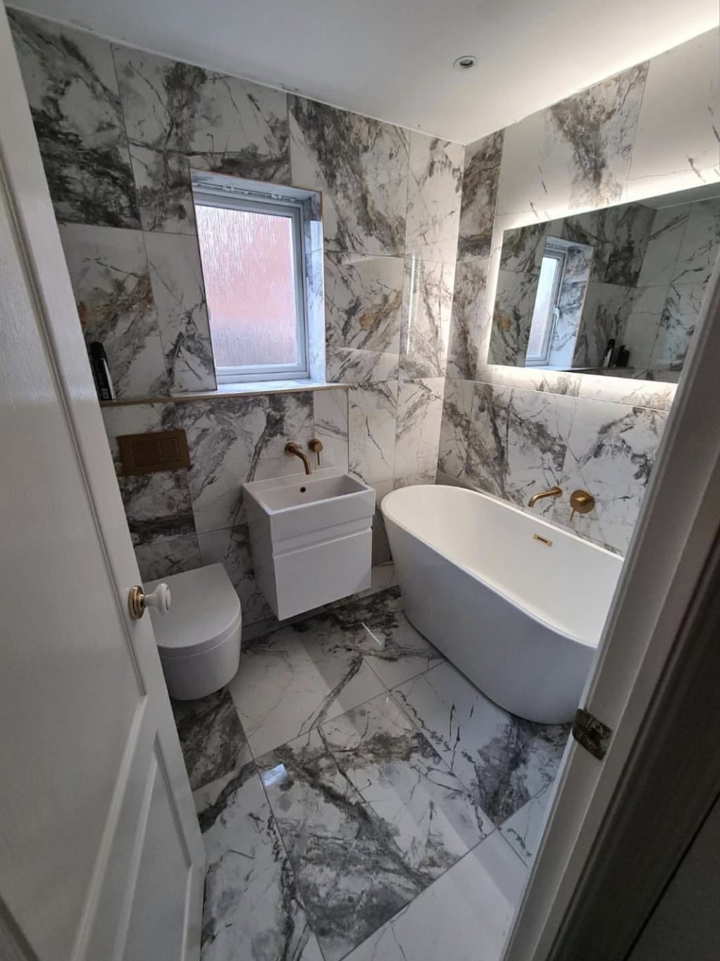 Marble bathroom installed by Plumbers Done Right Barnsley